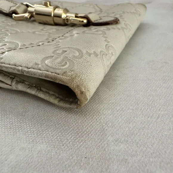 Gucci Guccissima Ivory Leather GG Logo BiFold Wallet, Gold Piston Closure